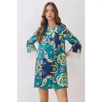 A sleeveless mini dress featuring an abstract football inspired print throughout. Designed with a round neckline, fitted silhouette, and an open back keyhole detail with self-tie closure.
