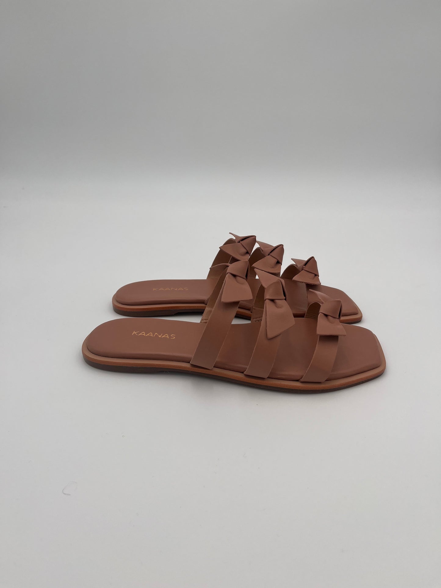 Recife Bow Allover Leather Slide in Nude